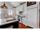 Well-equipped kitchen featuring an island with marble countertop, a gas range, and built-in refrigerator at 932 Middle St, Sullivans Island, SC 29482