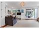 Bright living room featuring a comfortable sofa, stylish decor, and seamless outdoor access at 932 Middle St, Sullivans Island, SC 29482