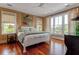 Beautiful main bedroom with hardwood floors, natural light and a neutral color palette at 932 Middle St, Sullivans Island, SC 29482