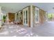 Spacious covered porch with comfortable seating and charming wood and shingle design at 932 Middle St, Sullivans Island, SC 29482