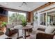 Cozy sunroom with comfortable seating and a beautiful view of the outdoors at 932 Middle St, Sullivans Island, SC 29482