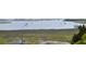 This view shows the water and the marshlands surrounding the property at 932 Middle St, Sullivans Island, SC 29482