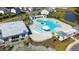 Aerial view of community pool, clubhouse, palm trees, and seating areas with shade structures at 9815 Seed St, Ladson, SC 29456