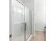 Modern bathroom features a glass shower and gray walls at 9815 Seed St, Ladson, SC 29456