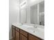 Bathroom with double sinks and a glass-enclosed shower at 9815 Seed St, Ladson, SC 29456