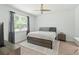 Bedroom with a ceiling fan, light wood floors, and neutral colored decor at 9815 Seed St, Ladson, SC 29456