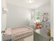 bedroom with a play tent, dollhouse, and bright decor at 9815 Seed St, Ladson, SC 29456