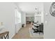 Bright dining room with modern chandelier, neutral tones, and an open floor plan at 9815 Seed St, Ladson, SC 29456