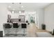 Inviting kitchen with granite countertops, stainless steel appliances, and open to dining and living areas at 9815 Seed St, Ladson, SC 29456