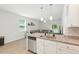 Open-concept kitchen featuring granite counters, stainless steel appliances, and a view to the living room at 9815 Seed St, Ladson, SC 29456