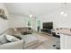 Comfortable living room with a large sectional sofa, open to the kitchen and dining areas at 9815 Seed St, Ladson, SC 29456