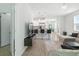 Bright living room with breakfast bar, comfortable seating, and an open concept design at 9815 Seed St, Ladson, SC 29456