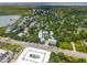 An aerial view showcasing the neighborhood with lush greenery and well-maintained homes, near the waterway at 992 Key Colony Ct, Mount Pleasant, SC 29464
