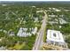 An aerial view displaying the neighborhood with lush greenery, and well-maintained homes near the main road at 992 Key Colony Ct, Mount Pleasant, SC 29464