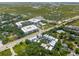 An aerial view showcasing the neighborhood with lush greenery and well-maintained homes near the wetlands at 992 Key Colony Ct, Mount Pleasant, SC 29464