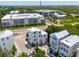 Aerial view featuring a modern coastal home near a waterway and marsh, with ample parking at 992 Key Colony Ct, Mount Pleasant, SC 29464
