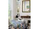 Cozy bedroom with colorful bedding, antique mirror, and a large window with blinders at 992 Key Colony Ct, Mount Pleasant, SC 29464