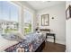 Bright bedroom with large windows, floral bedding, and hardwood floors at 992 Key Colony Ct, Mount Pleasant, SC 29464