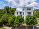 Beautifully landscaped exterior of a home with trees, walkways, and a three-story design at 992 Key Colony Ct, Mount Pleasant, SC 29464