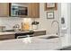 Well-lit kitchen with quartz counters, stainless steel appliances, and breakfast bar at 992 Key Colony Ct, Mount Pleasant, SC 29464