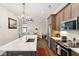 Modern kitchen with stainless steel appliances and large island overlooking living area at 992 Key Colony Ct, Mount Pleasant, SC 29464