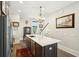 Kitchen island with white countertop and stainless steel appliances with hardwood flooring at 992 Key Colony Ct, Mount Pleasant, SC 29464