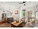 Open-concept living room and kitchen area with modern furnishings, a staircase and hardwood floors at 992 Key Colony Ct, Mount Pleasant, SC 29464