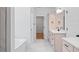 Bright bathroom featuring double vanity with modern fixtures and a separate bathtub at 0 Butterfly Ln, Awendaw, SC 29429
