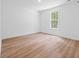 This bright bedroom features luxury vinyl plank flooring and natural light at 0 Butterfly Ln, Awendaw, SC 29429