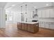 Modern kitchen island features pendant lighting, sink, and ample counter space at 0 Butterfly Ln, Awendaw, SC 29429