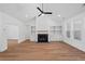 Bright living room boasts fireplace, built-ins, ceiling fan, and hardwood floors at 0 Butterfly Ln, Awendaw, SC 29429