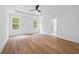 Spacious main bedroom with tray ceiling, hardwood floors, and natural light at 0 Butterfly Ln, Awendaw, SC 29429