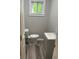 Updated bathroom featuring a modern vanity and toilet at 103 Ann St, Saint George, SC 29477