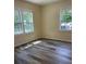 Comfortable bedroom with ample sunlight and refinished hardwood floors at 103 Ann St, Saint George, SC 29477