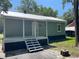 Charming home exterior showcasing fresh paint and a new metal roof at 103 Ann St, Saint George, SC 29477