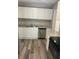 Contemporary kitchen with granite countertops, stainless appliances, and modern white cabinets at 103 Ann St, Saint George, SC 29477