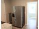 Contemporary kitchen featuring granite countertops and stainless steel refrigerator at 103 Ann St, Saint George, SC 29477