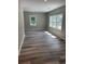 Bright and spacious living room with refinished flooring and new paint at 103 Ann St, Saint George, SC 29477