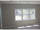 Bright living room featuring refinished hardwood floors and plenty of natural light at 103 Ann St, Saint George, SC 29477