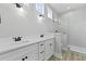 Modern bathroom with double vanity, sleek fixtures, and glass-enclosed shower at 104 Brightwood Dr, Huger, SC 29450