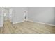 Spacious bedroom with light wood floor, with view to bathroom and closet at 104 Brightwood Dr, Huger, SC 29450