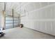 Bright and spacious garage interior features concrete floor and clean, white walls at 104 Brightwood Dr, Huger, SC 29450