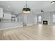 Modern living room with open floor plan to kitchen with stainless appliances at 104 Brightwood Dr, Huger, SC 29450