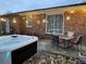 Backyard with a hot tub, patio, outdoor furniture, and overhead lights, perfect for relaxing evenings at home at 104 Jackson Rd, Ladson, SC 29456