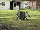 Backyard featuring a makeshift fire pit surrounded by chairs, partially enclosed with chain link fencing, ideal for outdoor gatherings at 104 Jackson Rd, Ladson, SC 29456