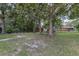 Large backyard with mature trees and a shed at 104 Jackson Rd, Ladson, SC 29456