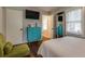Bright bedroom featuring a turquoise dresser, mounted TV, and wood flooring at 104 Jackson Rd, Ladson, SC 29456