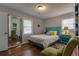 Bright bedroom with a queen-sized bed, hardwood floors, and natural light, creating a peaceful retreat for relaxation at 104 Jackson Rd, Ladson, SC 29456