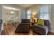 Cozy dining area with a decorative chandelier and white dining set seen from living area at 104 Jackson Rd, Ladson, SC 29456