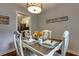 Cozy dining room with a light fixture, set table for four and simple decor that creates a warm and inviting space at 104 Jackson Rd, Ladson, SC 29456